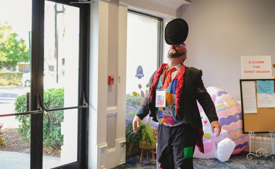 Charles Lauder balancing a hat at the World Clown Association Convention in Orlando, Florida on March 20, 2023.