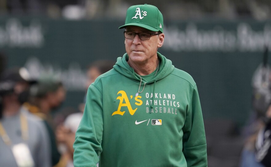 In this Aug. 20, 2021, file photo, Oakland Athletics manager Bob Melvin walks on the field before the team's baseball game against the San Francisco Giants in Oakland, Calif.