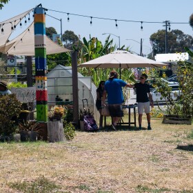 Danny Kaffer, one of the caregivers of Mt. Hope Community Garden, greets a visitor in the garden.