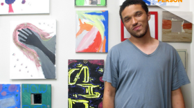 David McConnell is pictured at the Sherman Heights location of Urban Beats in front of a wall of artwork, July 20, 2018.