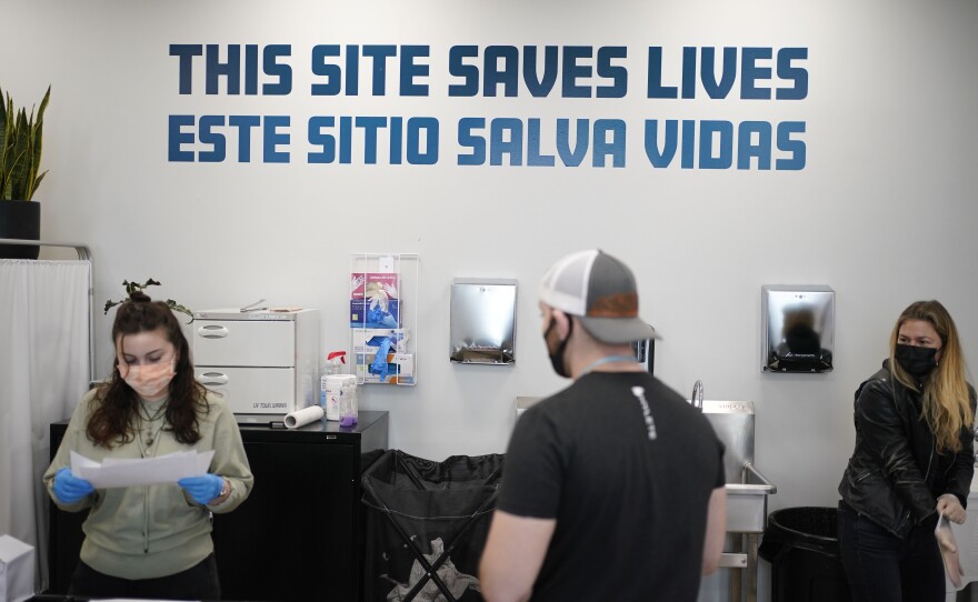 A sign on the wall reads "This site saves lives" in Spanish and English at an overdose prevention center at OnPoint NYC in New York, N.Y., Friday, Feb. 18, 2022.