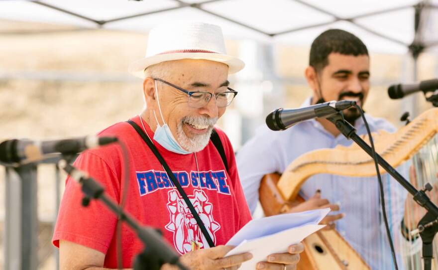 Juan Felipe Herrera, former poet laureate of the United States, performs with Los Originarios del Plan at the Madera Flea Market on June 13, 2021.