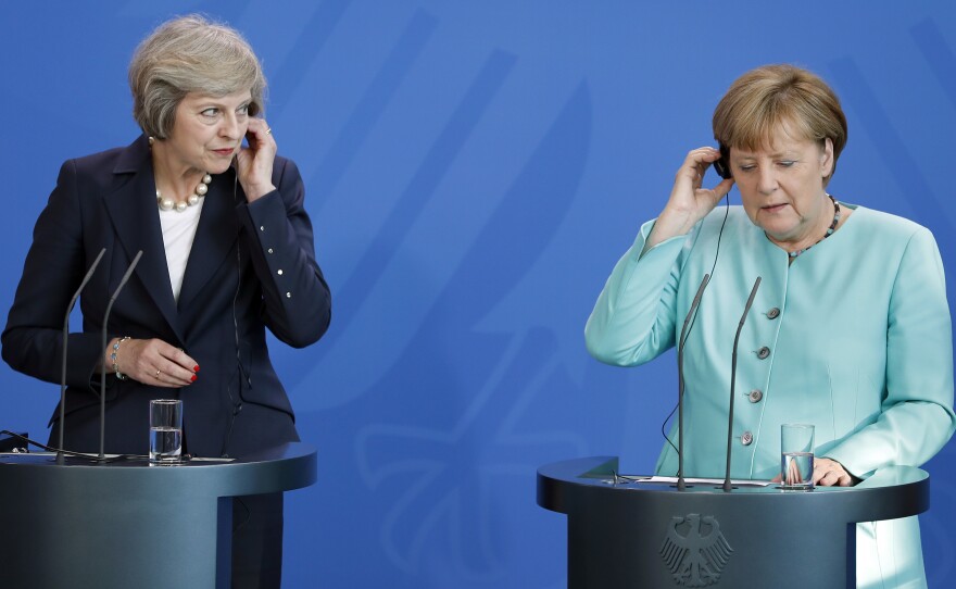 German Chancellor Angela Merkel (right), and British Prime Minister Theresa May (left), listen to translations during a joint news conference in Berlin on July 20. They are the two most important figures in the negotiations over Britain's departure from the European Union, the so-called Brexit.