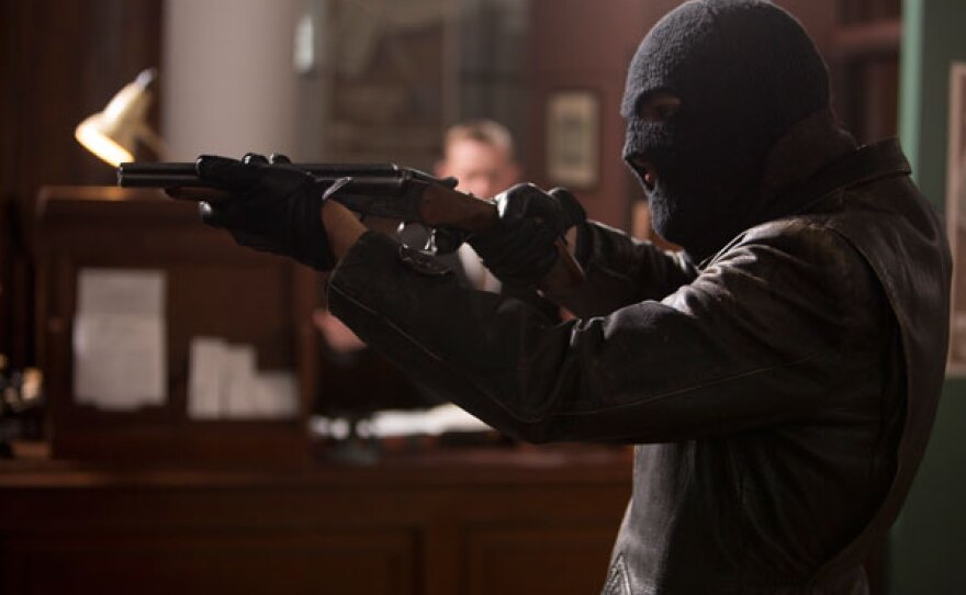Robber with gun.
