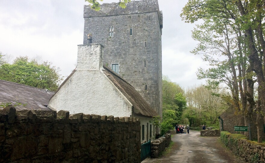 A school group gathers outside Thoor Ballylee, a 15th-century stone tower where Yeats lived for many years.