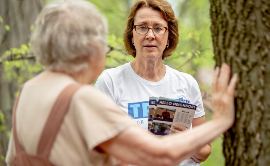 Trish Gunby, Democratic congressional candidate for MO-02, speaks to Mickie Dissett, 83, while canvassing for voter support in Glendale, Mo.