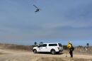 Ground and air crews work to put out the November Fire on Camp Pendleton on June 10, 2026.