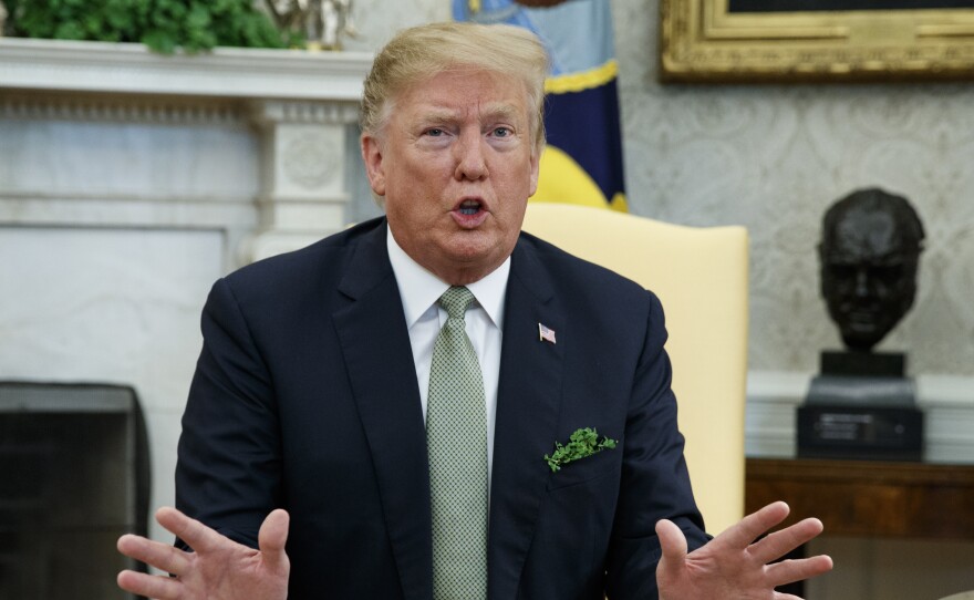 President Donald Trump speaks  in the Oval Office on March 14, 2019.