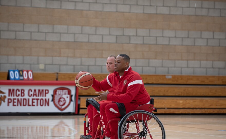 Marine Gunnery Sgt. Vincent Webb dribbles up the court during wheelchair basketball practice at the Warrior Trials at Marine Corps Base Camp Pendleton Wednesday, Feb. 25, 2026.