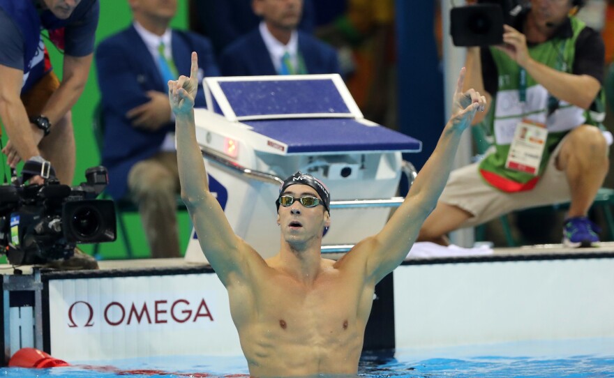 Michael Phelps celebrates winning the gold medal in the 200-meter butterfly on Tuesday night. In taking his 20th Olympic gold, Phelps also avenged a narrow loss in the event in 2012 to South Africa's Chad le Clos, who finished fourth.