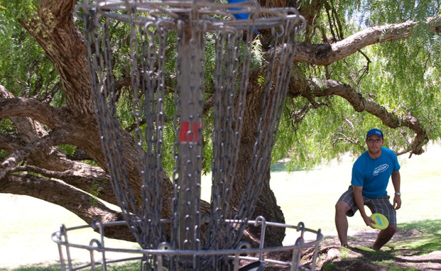 Angel Garcia, the Morley Field course pro, is pictured taking aim at a basket in this undated photo.