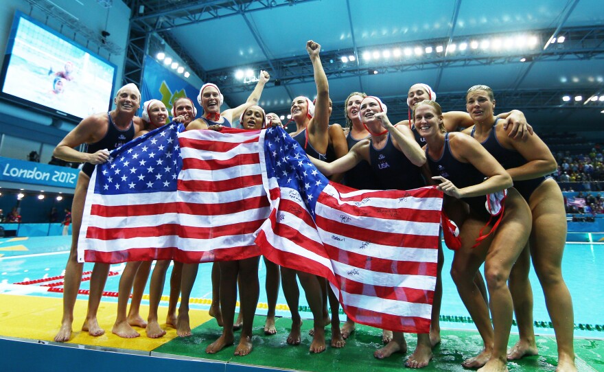 The U.S. women's water polo team celebrates after winning the gold medal match against Spain at the London Olympic Games in 2012.