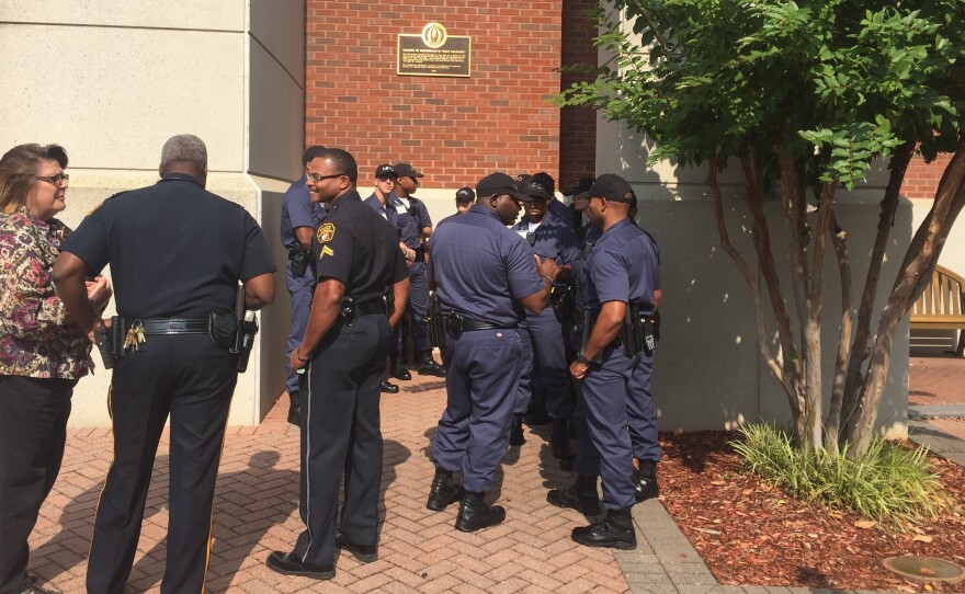 Montgomery police cadets gathered outside the Rosa Parks Museum before a tour. The tour is part of a course called "Policing in a Historic City: Civil rights and Wrongs in Montgomery."