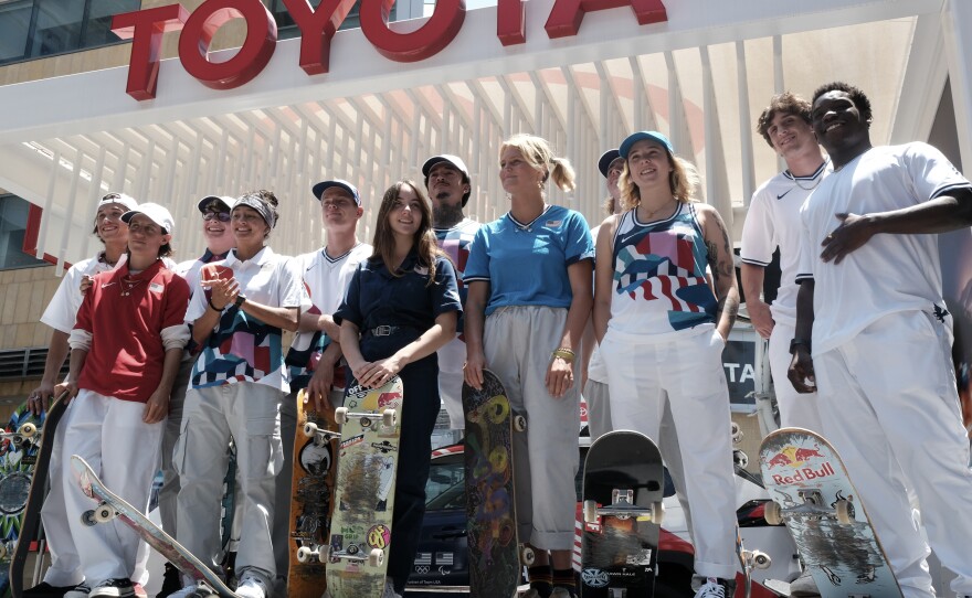 Members of the first U.S. Olympic skateboarding team pose for photos with their boards during a news conference in downtown Los Angeles on Monday, June 21, 2021.