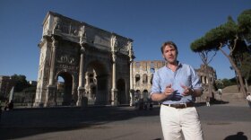 Host Jonathan Phillips beside the Arch of Constantine in Rome.