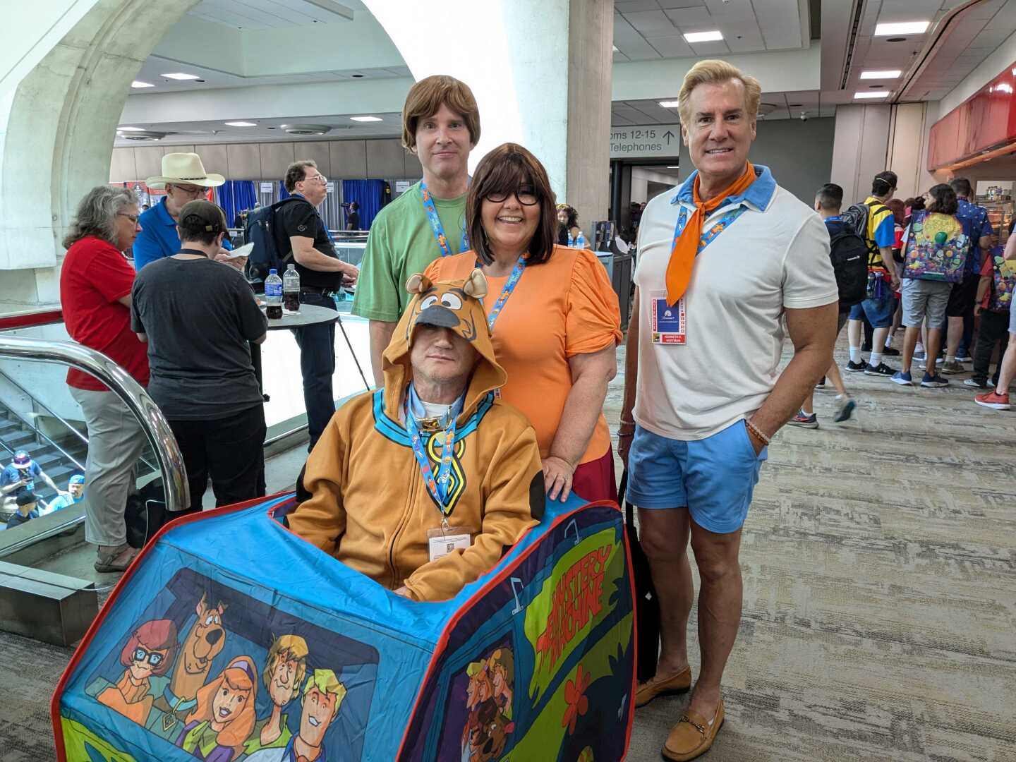 Comic-Con attendees Tim McMullen, Christe McMullen, Ken Hoffman and Darren Muir pose for a photo dressed as characters from Scooby-Doo on July 25, 2024. San Diego, Calif.