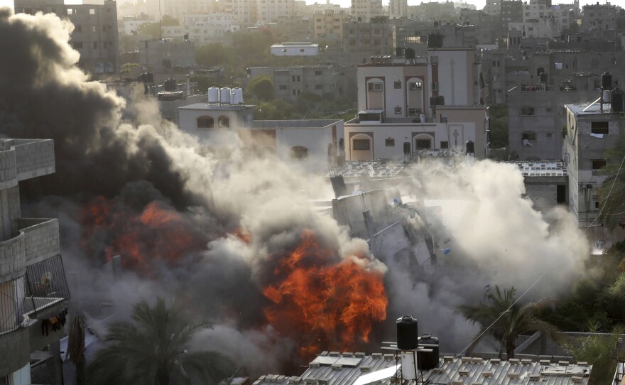 Smoke and fire rise from an explosion caused by an Israeli airstrike targeting a building in Gaza, on Saturday. The building was owned by an Islamic Jihad official.