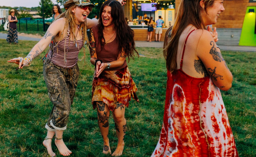People dance to Widespread Panic's performance during All Good Now festival at Merriweather Post Pavilion.