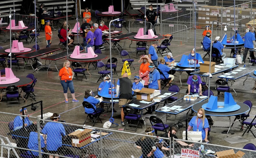 Maricopa County ballots cast in the 2020 general election are examined and recounted on May 6 at Veterans Memorial Coliseum in Phoenix.