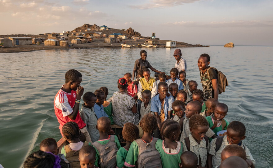 El Molo children travel to school by boat from their home on Komote Island, a new island formed by rising water levels in lake Turkana. The boat rides cost families 100 shillings per child per crossing, a huge daily expense for families already living below the poverty line. When the weather is stormy, children stay home and miss school.