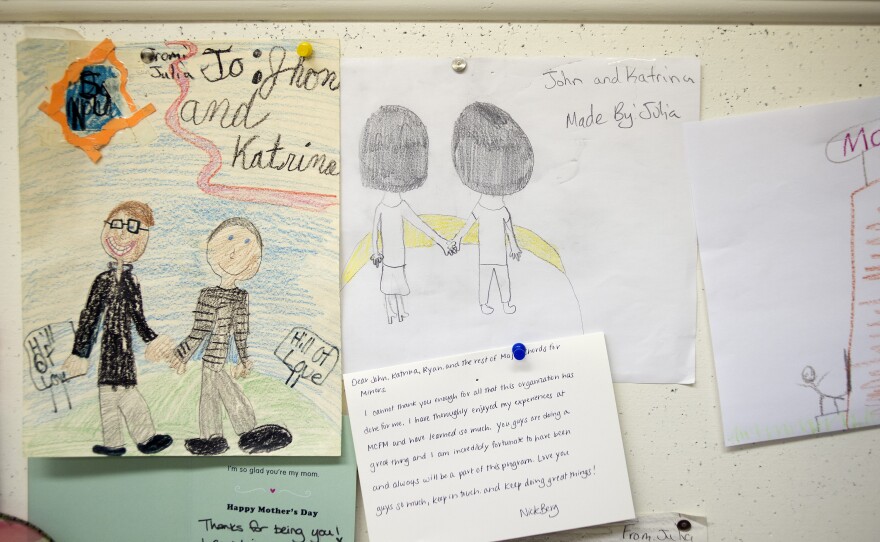 Thank you notes and student drawings hang on the cork board surrounding the Major Chords for Minors office. Co-founders John and Katrina Vowell let the kids hang out in the office before and after their music lessons to color, talk or to do their homework.