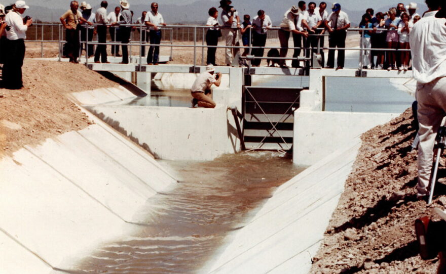 Water from the Colorado River flows through the Central Arizona Project system in the desert west of Phoenix for the first time on May 22, 1985. The 336-mile canal system has helped fuel the development of the Phoenix and Tucson areas. Now, it faces major cutbacks to its water supplies as the Colorado River dries up due to drought and climate change.