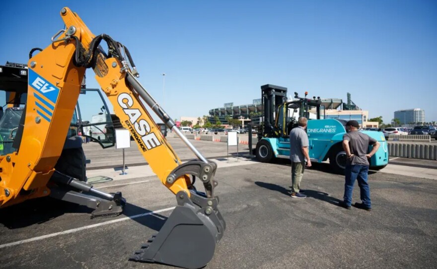 An electric backhoe loader forklift on display at the Anaheim showcase. Zero-emission equipment like this could replace diesels, which emit fine particles of soot.