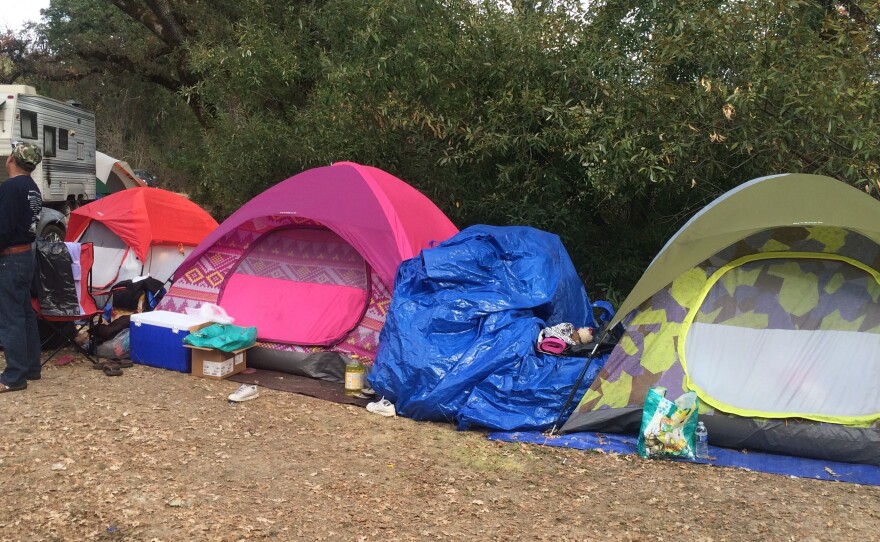 Homeless fire victims live in tents like these in Middletown, Calif. Patricia Madrigal's tent is yellow and gray.