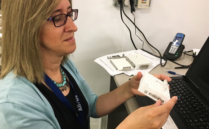 Mine Cicek, an assistant professor at the Mayo Clinic, processes samples for the All of Us program.