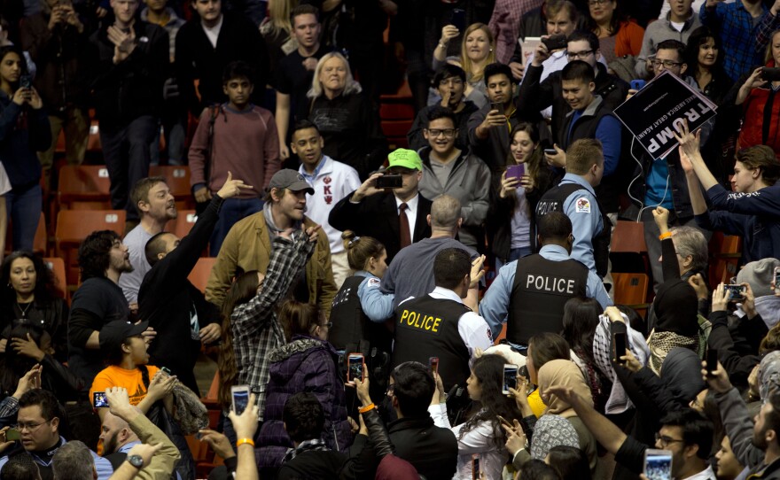 Anti-Donald Trump protesters confront his supporters during a Trump rally at the UIC Pavilion in Chicago on March 11, 2016.