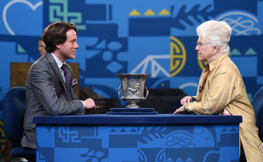 David Walker appraises an 1814 Paul Storr silver wine cooler in Little Rock, Arkansas.