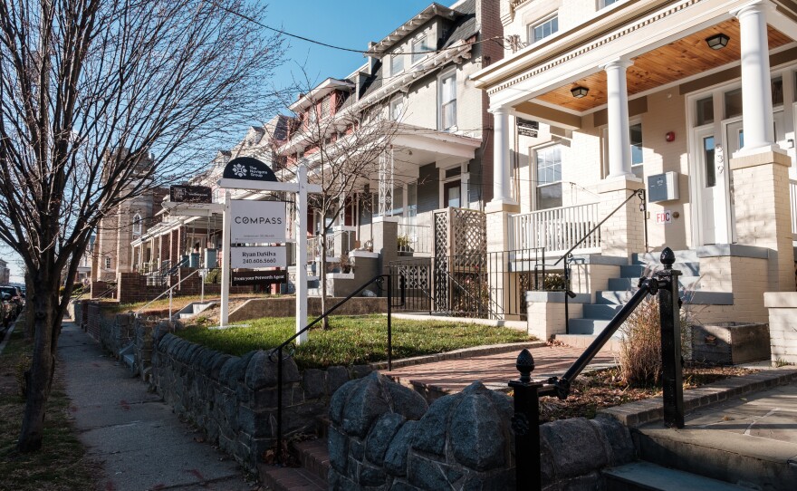 A for-sale sign stands in the yard of a home in the Petworth neighborhood of Washington, D.C.