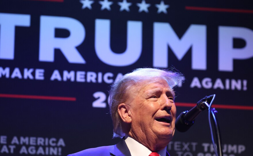 Former President Donald Trump speaks to guests gathered for an event at the Adler Theatre on March 13 in Davenport, Iowa.