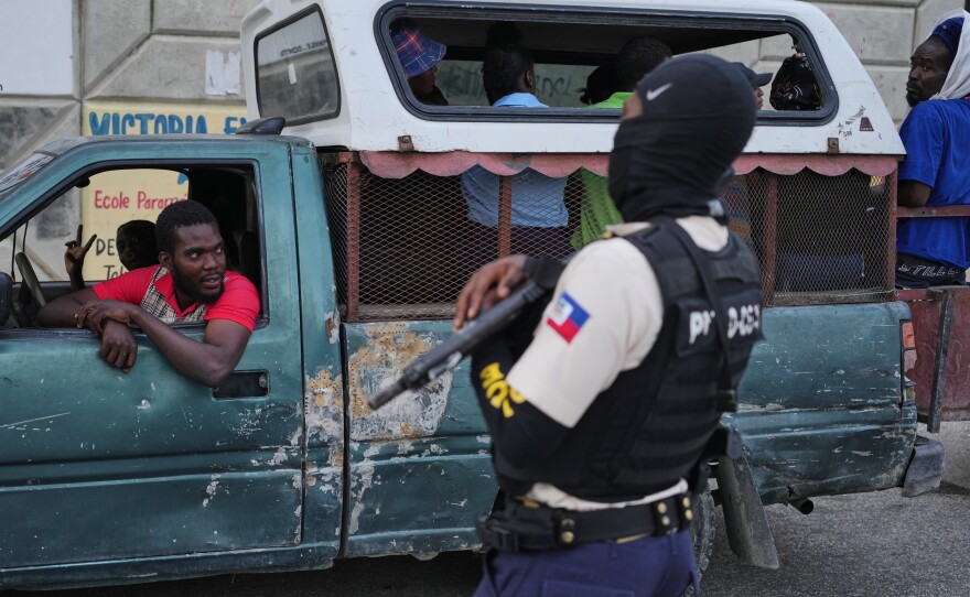 A police officer stands guard in Port-au-Prince, Haiti, Tuesday, March 3, 2026.