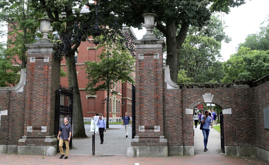 Pedestrians in Harvard Yard in 2019. Schools and businesses have gone to court to stop the Trump administration from barring online-only international students from entering or staying in the United States.