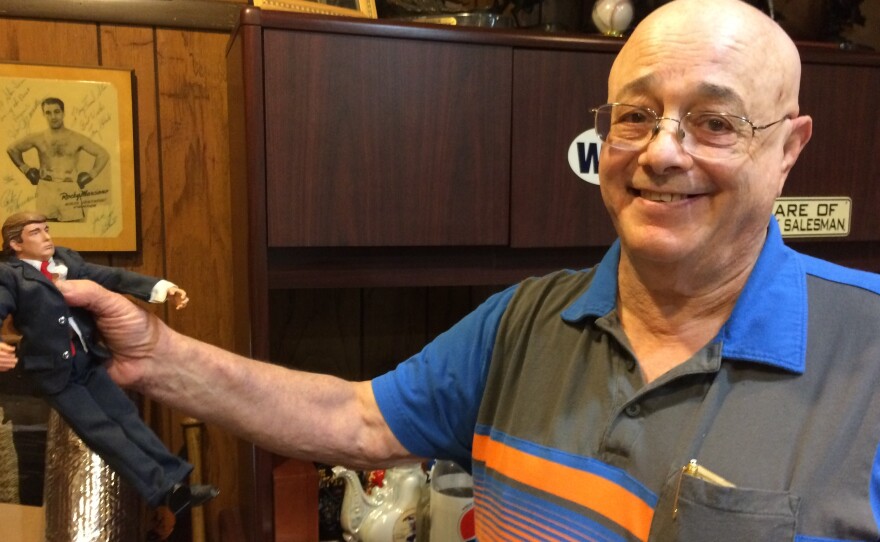 Classmate Ted Levine holds a talking Trump doll, which he sometimes squeezes for advice. It belts out Trumpisms such as "Brand yourself and toot your own horn," and "Have an ego – there's nothing wrong with ego."