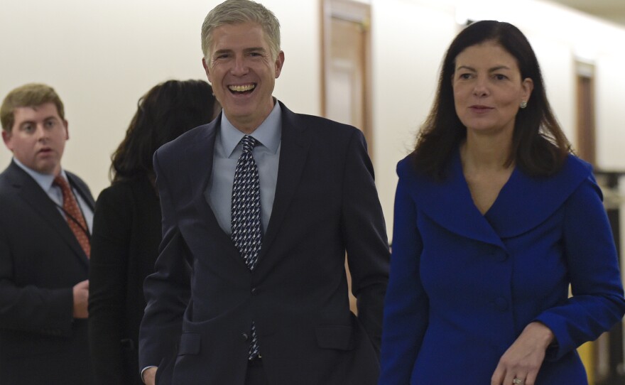 Supreme Court nominee Judge Neil Gorsuch, center, arrives with former New Hampshire Sen. Kelly Ayotte on Capitol Hill last week for a meeting with Sen. Bob Corker, R-Tenn. There are different kinds of conservative judges, from the pragmatist to the originalist. Gorsuch is a self-proclaimed originalist.