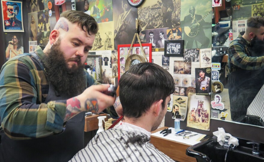 "Here in Moscow, it's still not very typical for people to wear head tattoos and piercing and beards," says barber Artemy Zolotarevsky. "When people see me, some are amazed, some give me mean looks. And so I think I'm a bit of an outlaw."