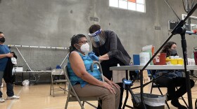 A patient receives a COVID-19 vaccine at Border View Family YMCA in Otay Mesa, Calif. Feb. 24, 2021.