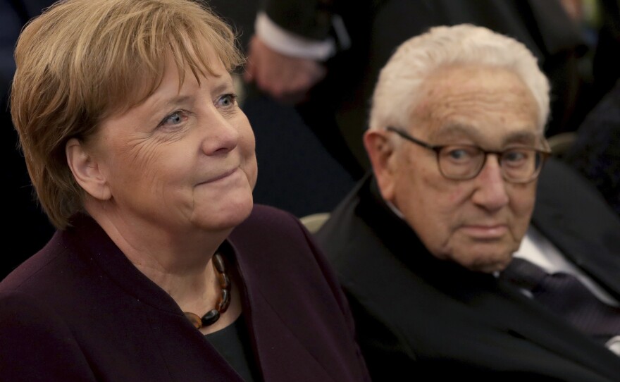 German Chancellor Angela Merkel and Henry A. Kissinger arrive for the award ceremony for the Henry A. Kissinger Prize 2020 at the Charlottenburg palace in Berlin on Jan. 21, 2020.