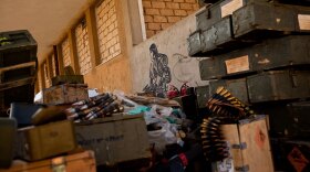 Ammunition and weapons are scattered around an arms depot in Ajdabiya, Libya, on Tuesday.