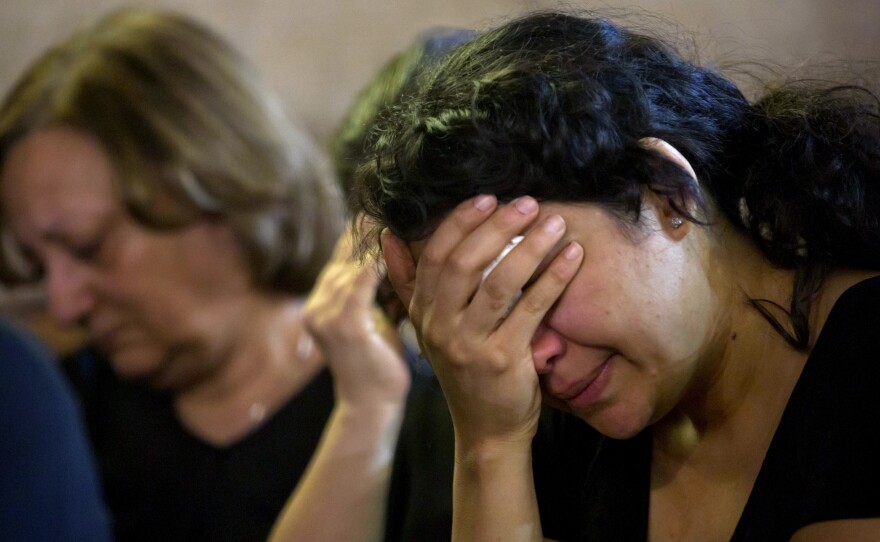 Coptic Christians grieve during prayers for the departed, remembering the victims of EgyptAir flight 804 at Al-Boutrossiya Church in Cairo, Egypt on Sunday.