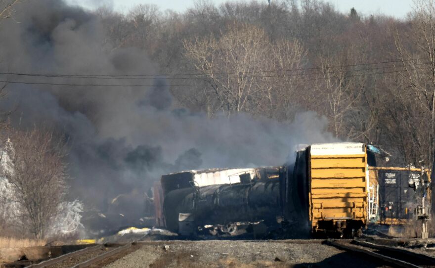 Smoke rises from the derailed cargo train in East Palestine, Ohio, on February 4.