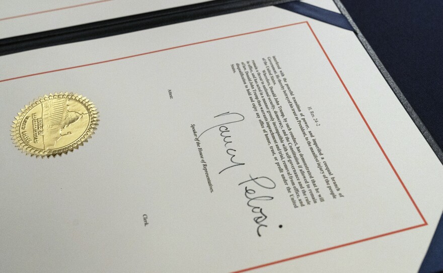 House Speaker Nancy Pelosi's signature is seen on the single article of impeachment against President Trump. The case against the president now moves to the U.S. Senate, which will consider the article after Trump is no longer in office.