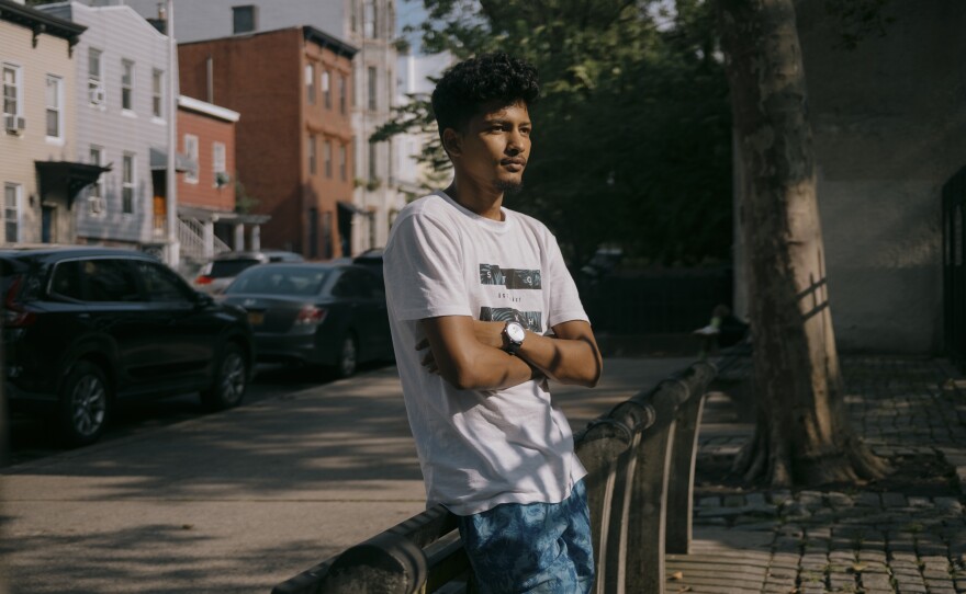 Elcoutoub, 21, an asylum-seeker from Mauritania, has has spent 20 days at the Clinton Hall shelter. He stands outside Washington Hall Park as he seeks relief from the congested confinements of 47 Hall St.