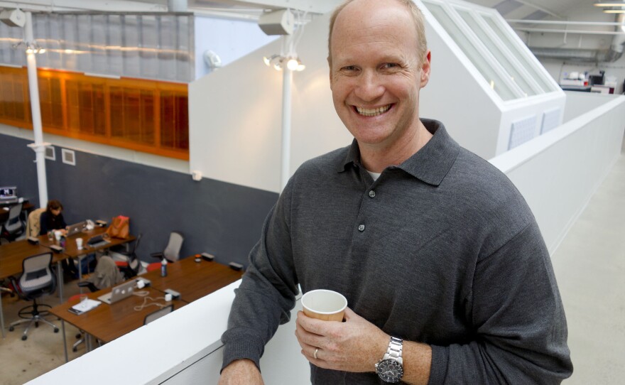 Galvanize co-founder Chris Onan holds a cup of Galvanize's signature coffee.