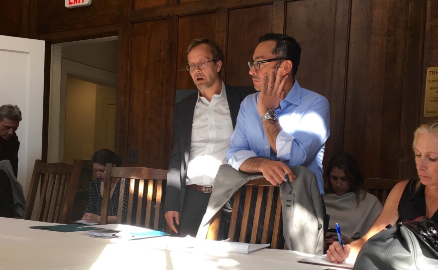 Silvio Carrillo, center, listens during a meeting with non-profit leaders.