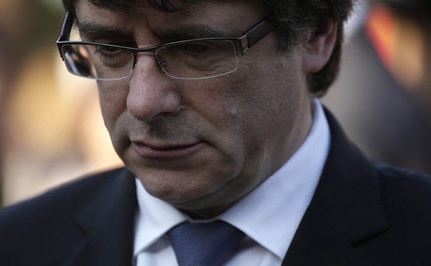 Catalan regional President Carles Puigdemont attends a ceremony commemorating the 77th anniversary of the death of Catalan leader Lluis Companys at the Montjuic Cemetery in Barcelona, Spain, on Sunday.