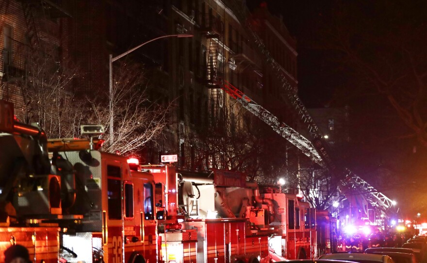 Officials said the Thursday night fire in the Bronx started in a first-floor kitchen by a 3-year-old boy who was playing with burners on a stove.