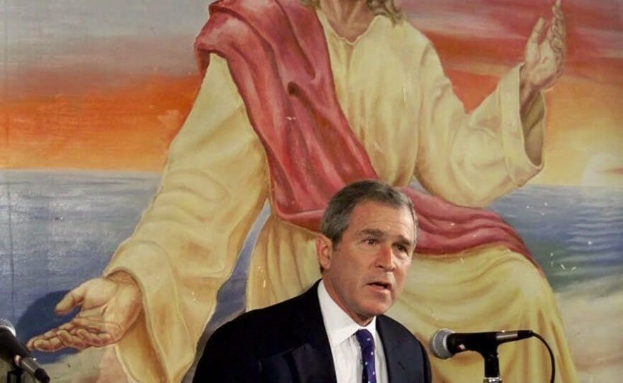 Then-Texas Gov. George W. Bush speaks in front of a painting of Jesus Christ during a campaign stop in Colfax, Iowa in 2000. Bush is the only Republican to win Iowa since 1976 and become president.